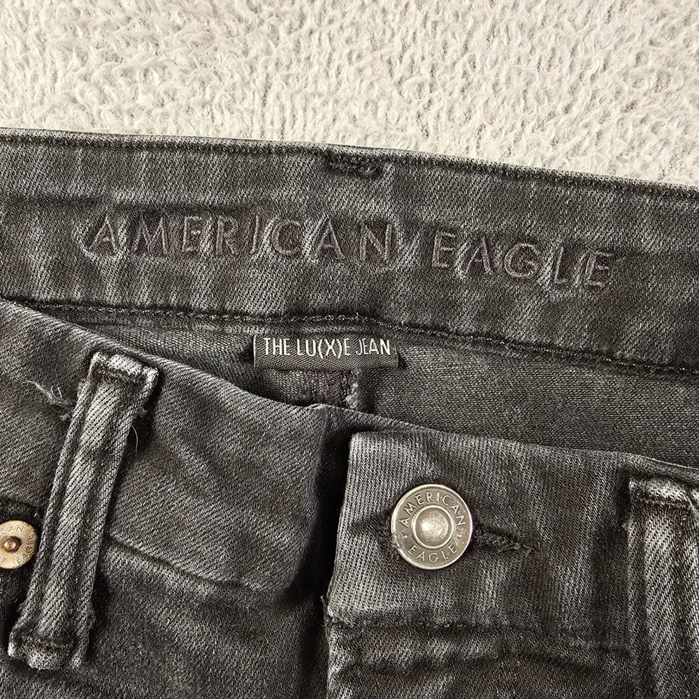 American Eagle Super Hi-Rise Jegging Luxe Jean Black Distressed 12 Regular